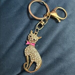 Elegant Gold Cat Keychain with Pink Bow